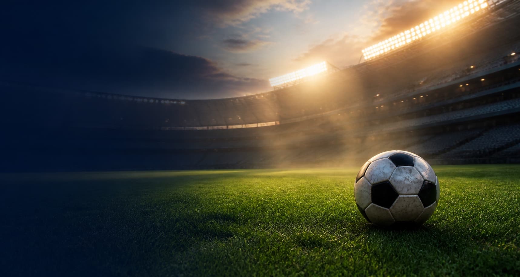 Pallone su un campo illuminato in uno stadio